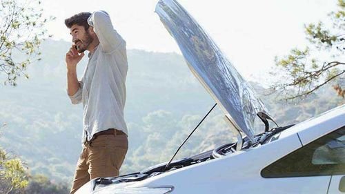 Man having a car mishap